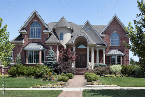 Photo: Brick home with turret Brick home with turret