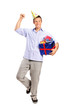Person wearing a party hat and holding a gift