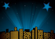 View of city at night with spotlights in background