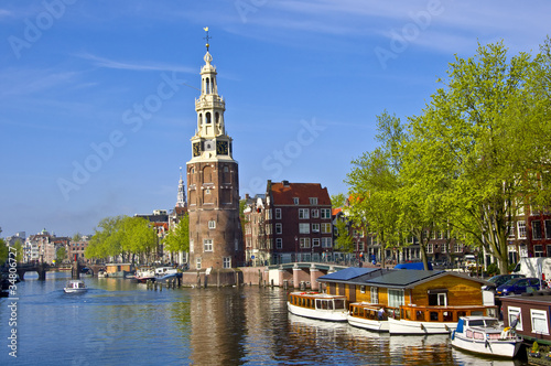 Photo: Classical Amsterdam view. Boat floats Classical Amsterdam view. Boat floats