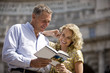 Photo: A middle-aged couple looking at a guidebook A middle-aged couple looking at a guidebook