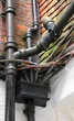 tangled wiring and guttering, pipes and electricals