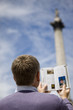 Photo: A middle-aged man in front of Nelson's column A middle-aged man in front of Nelson's column