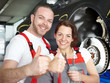 Foto: Master mechanic and apprentice show thump up Master mechanic and apprentice show thump up