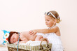 Toddler girl and newborn baby