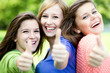 Friends showing thumbs up sign Friends showing thumbs up sign