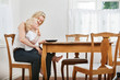 Photo: Baby and mother at dining table Baby and mother at dining table
