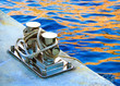 Mooring bollard with rope on sea background Mooring bollard with rope on sea background