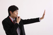 Man blowing whistle and making a stop gesture