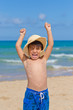 child in the beach in a playfull and happy atitude child in the beach in a playfull and happy atitude