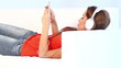 Sweet young girl on couch listen to the music with headphones