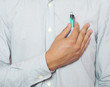 man taking pen from pocket