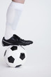 Man stepping on a football