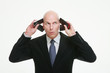 Businessman answering a few phone calls at the same time