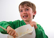 Smiling boy making a cake