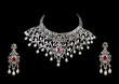 Close up of diamond necklace with diamond ear ring