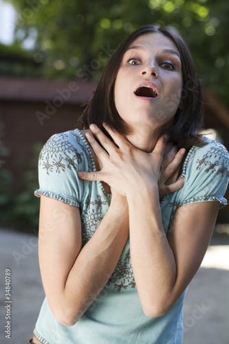 Photo: nervous woman strangling herself nervous woman strangling herself