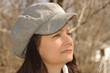 Young woman  profile with a cap