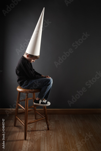 Photo: Child wearing a dunce cap Child wearing a dunce cap