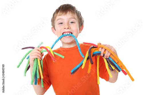 Photo: Boy holding colorful licorice candy Boy holding colorful licorice candy