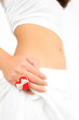 Girl with red heart-shaped ring on the hand and a towel