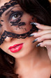 Foto: Beautiful lady with lacy mask on eyes Beautiful lady with lacy mask on eyes