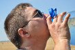 A young man with a thirst for drink cold water from A young man with a thirst for drink cold water from