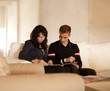 Photo: Lovely couple reading a book together Lovely couple reading a book together