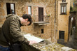 Adult Tourist Visiting Towns in Tuscany and Umbria, Italy