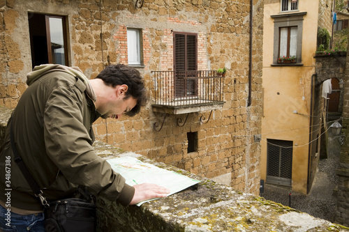 Photo: Adult Tourist Visiting Towns in Tuscany and Umbria, Italy Adult Tourist Visiting Towns in Tuscany and Umbria, Italy