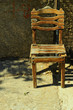 Photo en ligne au meilleur prix Single old wooden chair on sidewalk in Rethymno