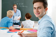 group of students  while studying in classroom