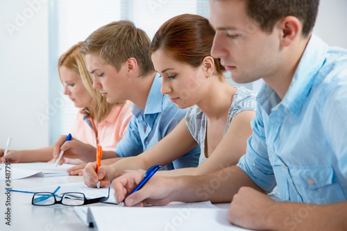 Photo: group of students studying together in a classroom group of students studying together in a classroom
