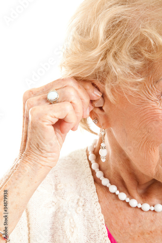 Photo: Inserting Hearing Aid Inserting Hearing Aid