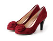 Pair of red suede female shoes over white Pair of red suede female shoes over white