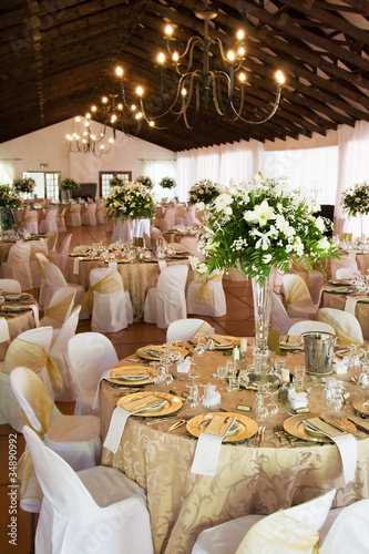 Photo: Wedding reception hall with laid tables Wedding reception hall with laid tables