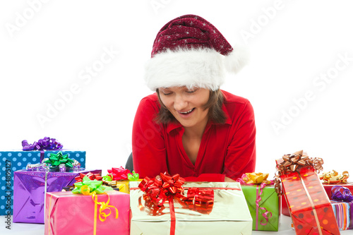 Foto: woman with christmas surprised between many gifts woman with christmas surprised between many gifts