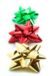 red, gold and green gift ribbons isolated on white