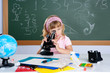 children little girl at school classroom with microscope children little girl at school classroom with microscope