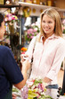 Woman shopping in florist