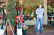 Man standing outside florist