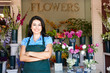 Woman standing outside florist