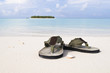 Flip-flop on white sand beach Flip-flop on white sand beach