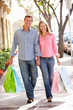 Couple carrying shopping