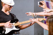 Selective focus on guitarist in action