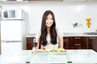 attractive asian woman on the kitchen