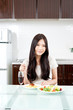 attractive asian woman in the kitchen