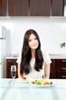 attractive asian woman in the kitchen