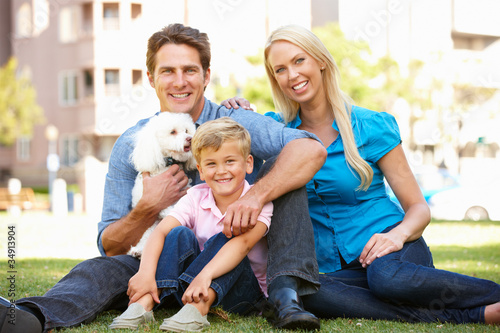 Photo: Couple in city park with young son and dog Couple in city park with young son and dog