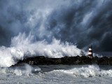 Stormy waves against beacon - Fine Art prints